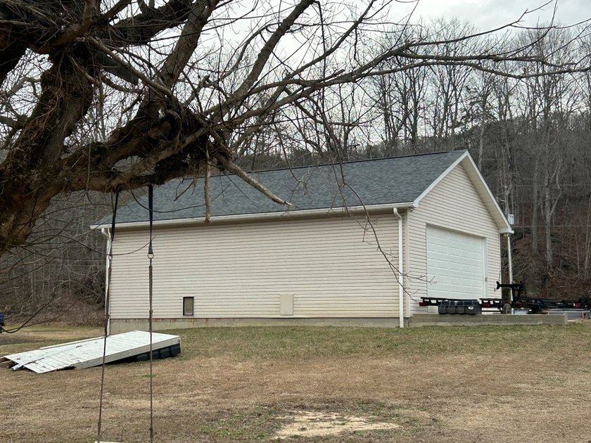 Enjoy nearly an acre of level waterfront property where the - photo 21