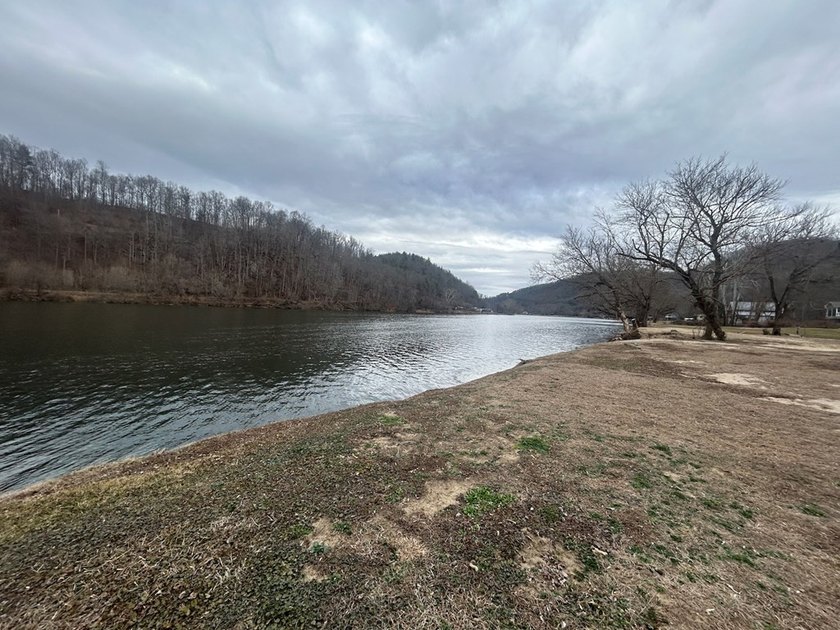 Enjoy nearly an acre of level waterfront property where the - photo 22
