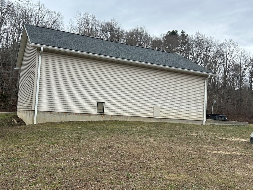 Enjoy nearly an acre of level waterfront property where the - photo 25