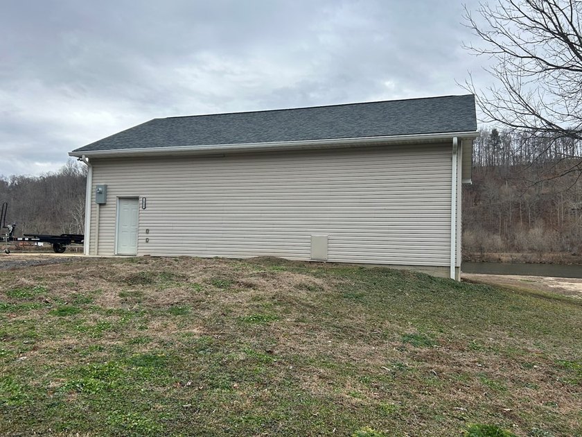 Enjoy nearly an acre of level waterfront property where the - photo 26