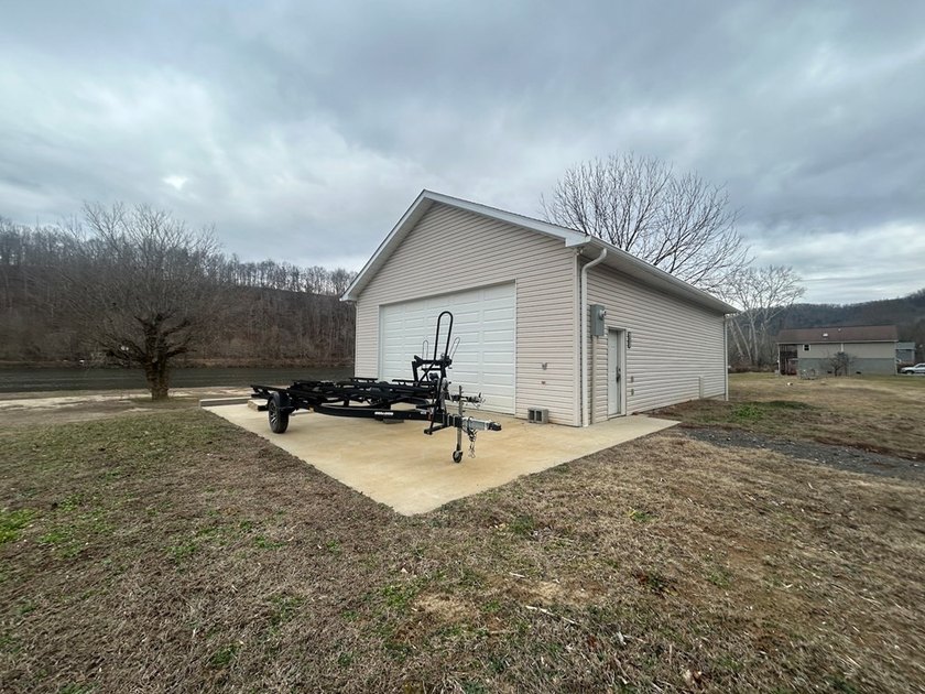 Enjoy nearly an acre of level waterfront property where the - photo 28