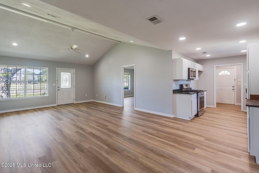 Beautifully updated home featuring an open floor plan, vaulted - photo 6