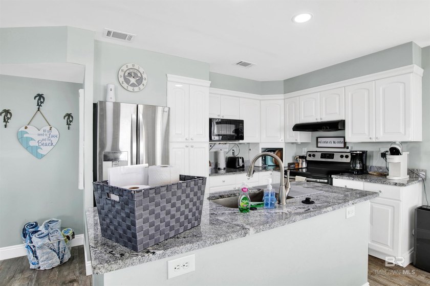 Beautifully upgraded bayfront home on a private road with no - photo 12