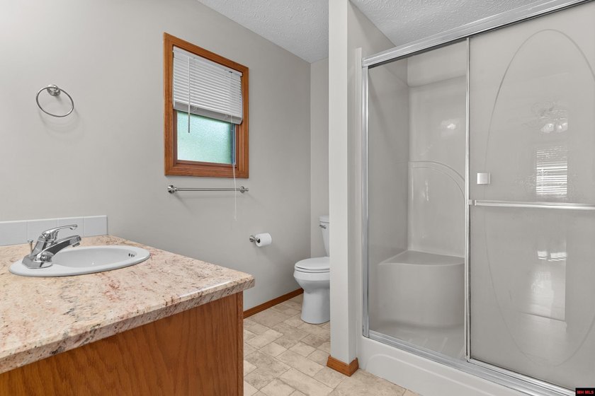 Spacious brick home on a beautiful corner lot offering over half - photo 24