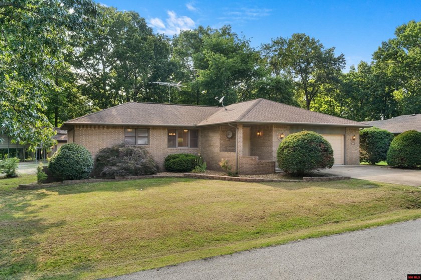 Spacious brick home on a beautiful corner lot offering over half - photo 32