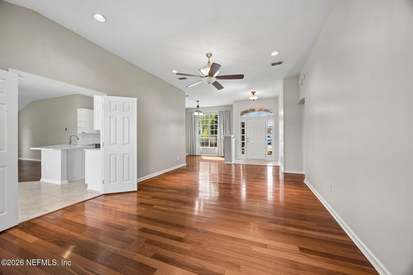 Welcome to this stunning lakefront retreat in the highly - photo 4