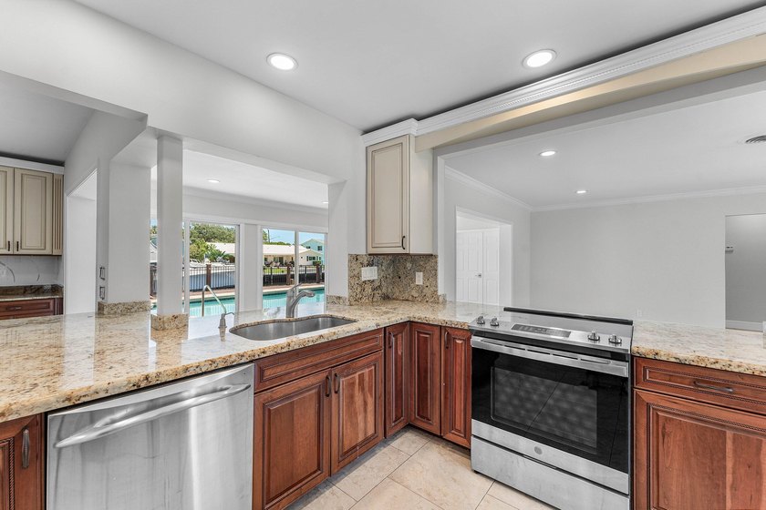 Experience luxury waterfront living in the prestigious Cove of - photo 9