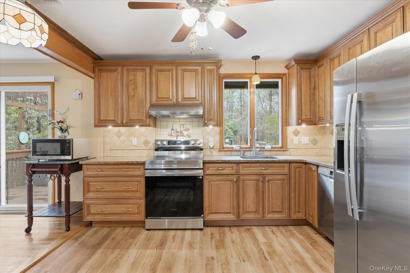 Feel the warmth of this home the moment you walk through the - photo 11