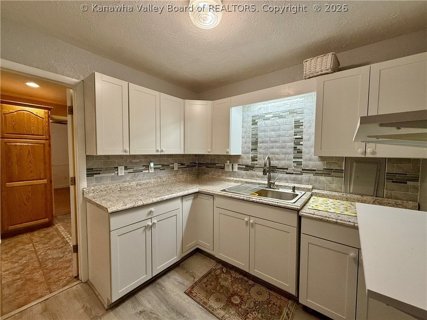 This well-maintained brick ranch-style home offers three - photo 18