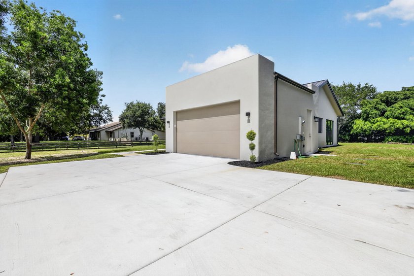 Welcome to this 2026 modern residence, nestled on a private - photo 3