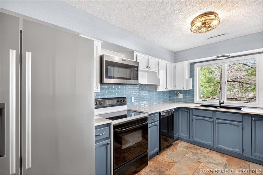 176 Kansas City Way in Sunrise Beach, MO 65079 offers a true - photo 12