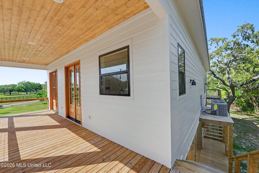 Enjoy coastal living on the beautiful Biloxi Back Bay in this - photo 3