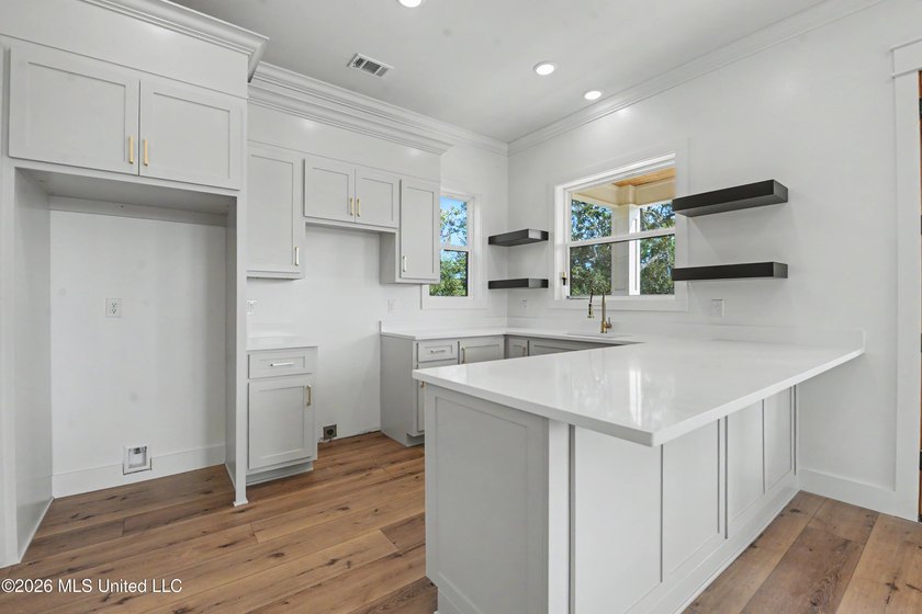 Enjoy coastal living on the beautiful Biloxi Back Bay in this - photo 8