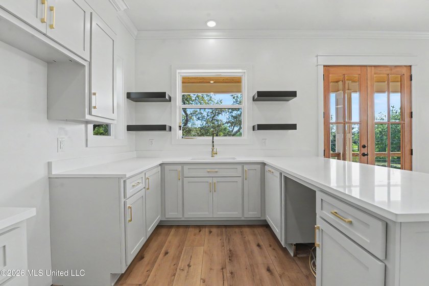 Enjoy coastal living on the beautiful Biloxi Back Bay in this - photo 9