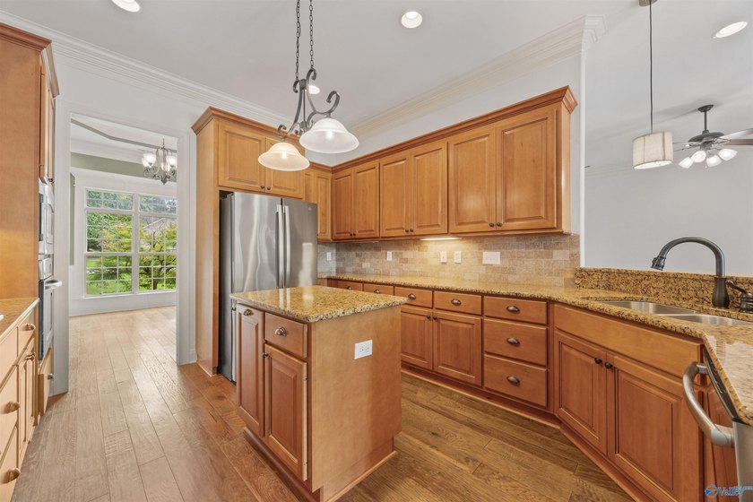 Lake-view ranch featuring 4 bedrooms, 4 full baths, a spacious - photo 12