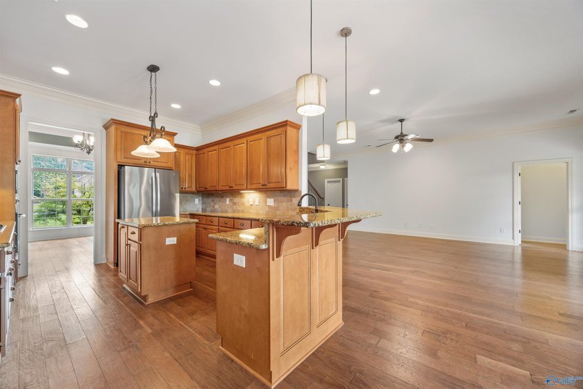 Lake-view ranch featuring 4 bedrooms, 4 full baths, a spacious - photo 13