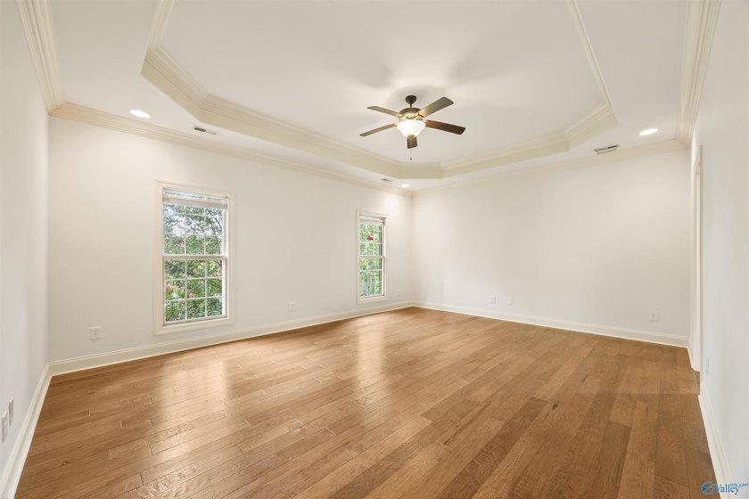 Lake-view ranch featuring 4 bedrooms, 4 full baths, a spacious - photo 16