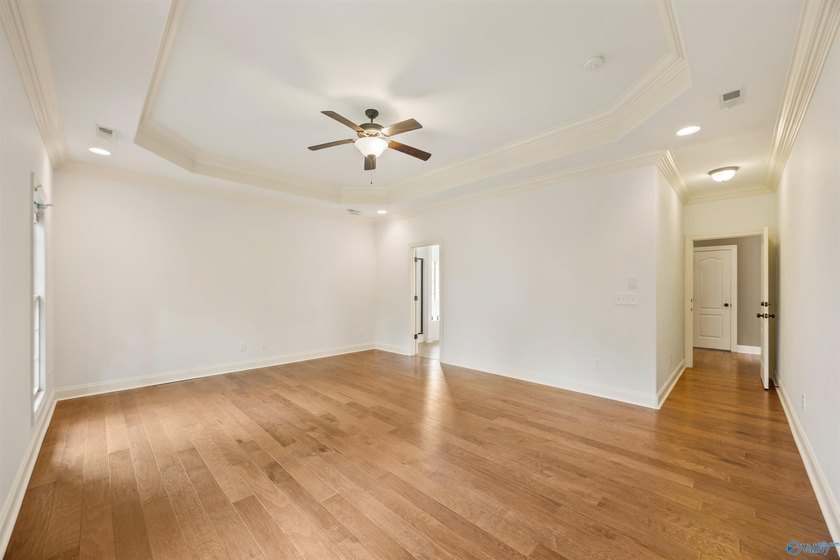 Lake-view ranch featuring 4 bedrooms, 4 full baths, a spacious - photo 17