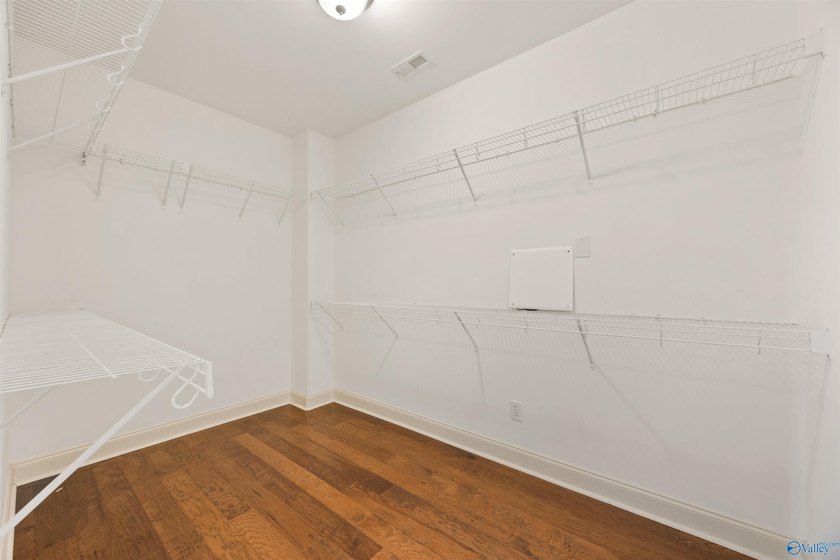 Lake-view ranch featuring 4 bedrooms, 4 full baths, a spacious - photo 18