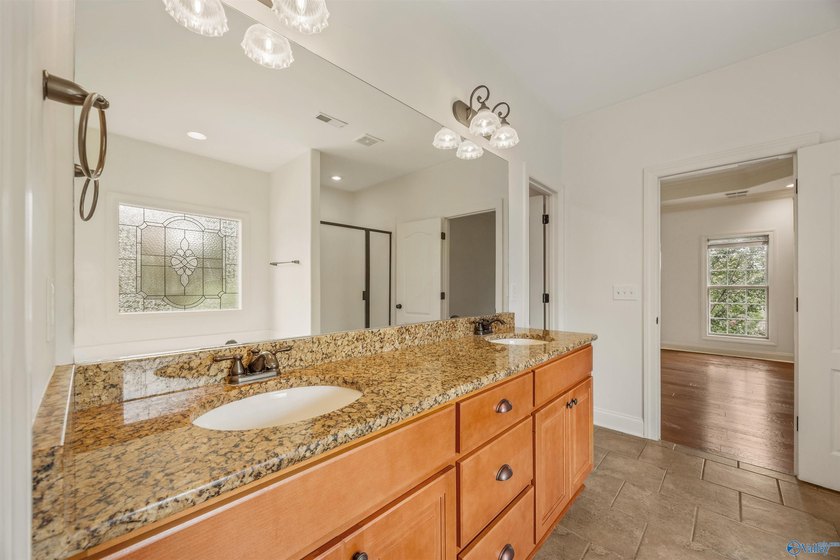 Lake-view ranch featuring 4 bedrooms, 4 full baths, a spacious - photo 20