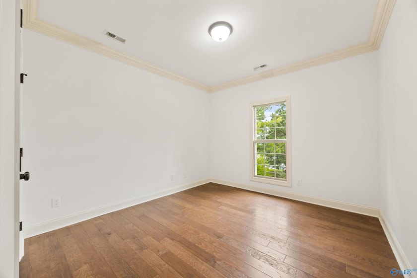 Lake-view ranch featuring 4 bedrooms, 4 full baths, a spacious - photo 22