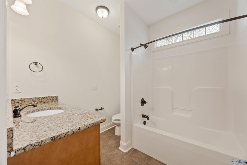 Lake-view ranch featuring 4 bedrooms, 4 full baths, a spacious - photo 23