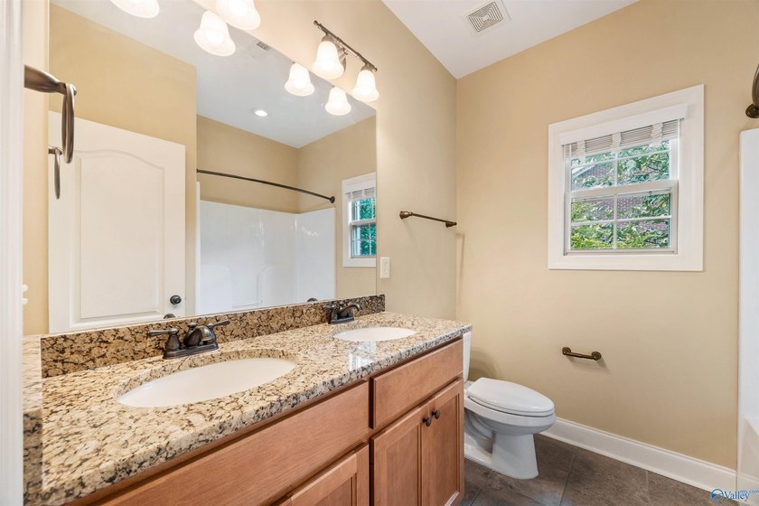 Lake-view ranch featuring 4 bedrooms, 4 full baths, a spacious - photo 25