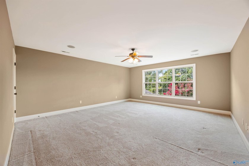 Lake-view ranch featuring 4 bedrooms, 4 full baths, a spacious - photo 27