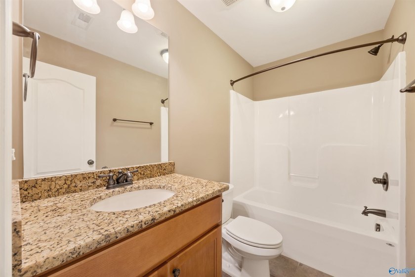 Lake-view ranch featuring 4 bedrooms, 4 full baths, a spacious - photo 28