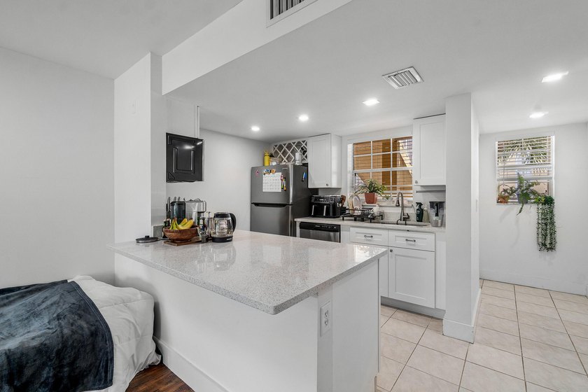 Beautifully renovated 2-bedroom, 2-bath end-unit condo in the - photo 9