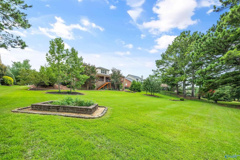 Lake-view ranch featuring 4 bedrooms, 4 full baths, a spacious - photo 33