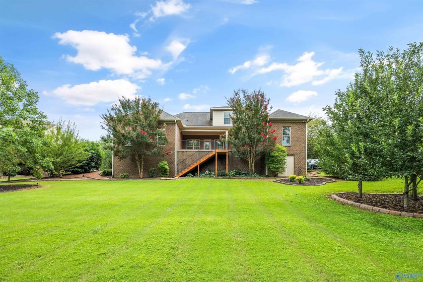 Lake-view ranch featuring 4 bedrooms, 4 full baths, a spacious - photo 34