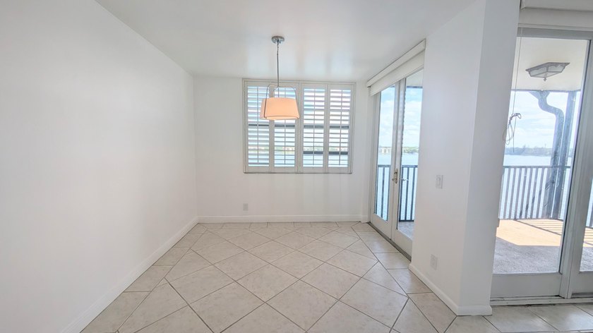 Enjoy beautiful lake views from this bright and inviting - photo 3