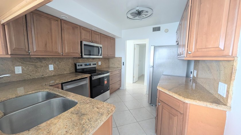 Enjoy beautiful lake views from this bright and inviting - photo 9