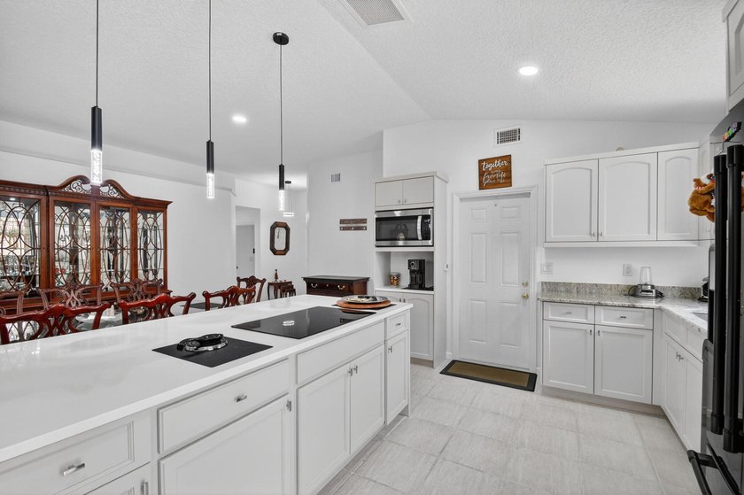 WOW - Awesome pool home with renovated kitchen, flooring and - photo 11