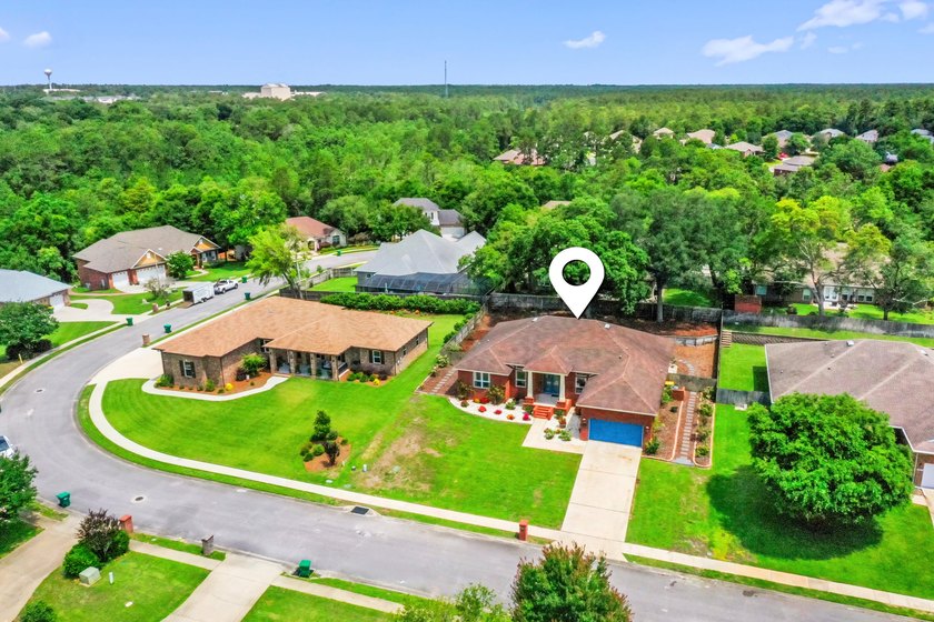Before you reach the front door at 335 Grove Park Drive, the - photo 13