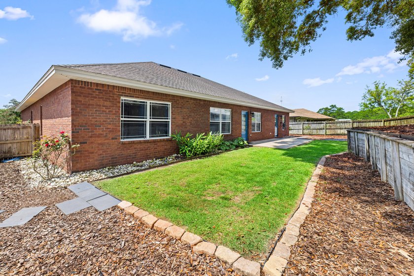 Before you reach the front door at 335 Grove Park Drive, the - photo 20
