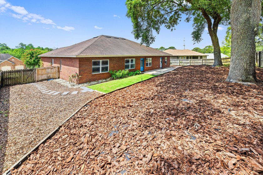 Before you reach the front door at 335 Grove Park Drive, the - photo 23