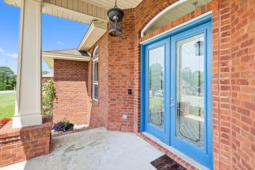 Before you reach the front door at 335 Grove Park Drive, the - photo 25