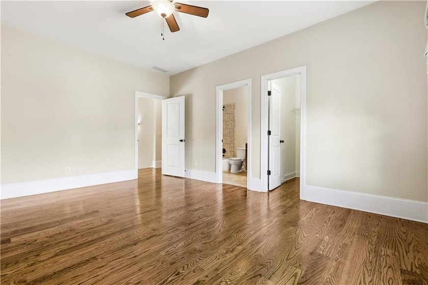 FOUR car garage! Primary suite options on both the main and - photo 34
