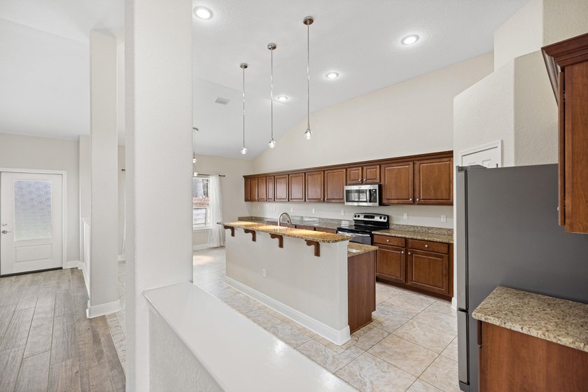 Before you reach the front door at 335 Grove Park Drive, the - photo 37