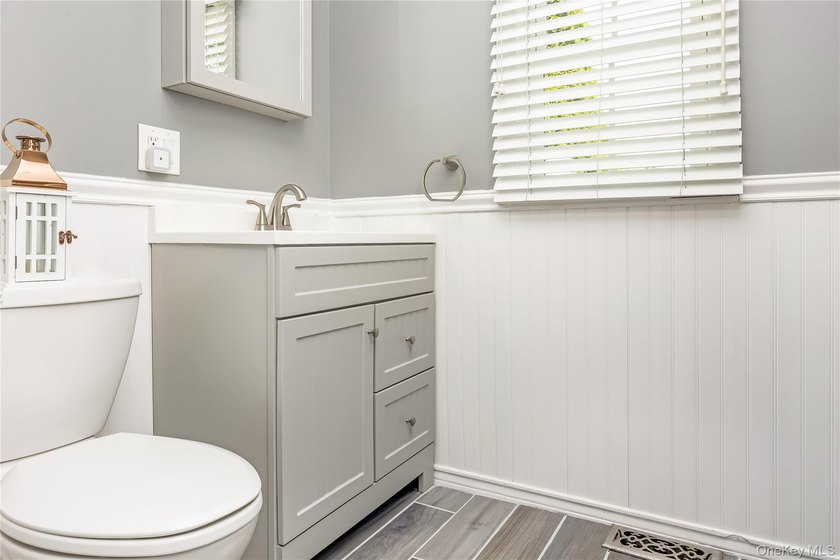 Welcome to this beautifully updated expanded Cape nestled in the - photo 12