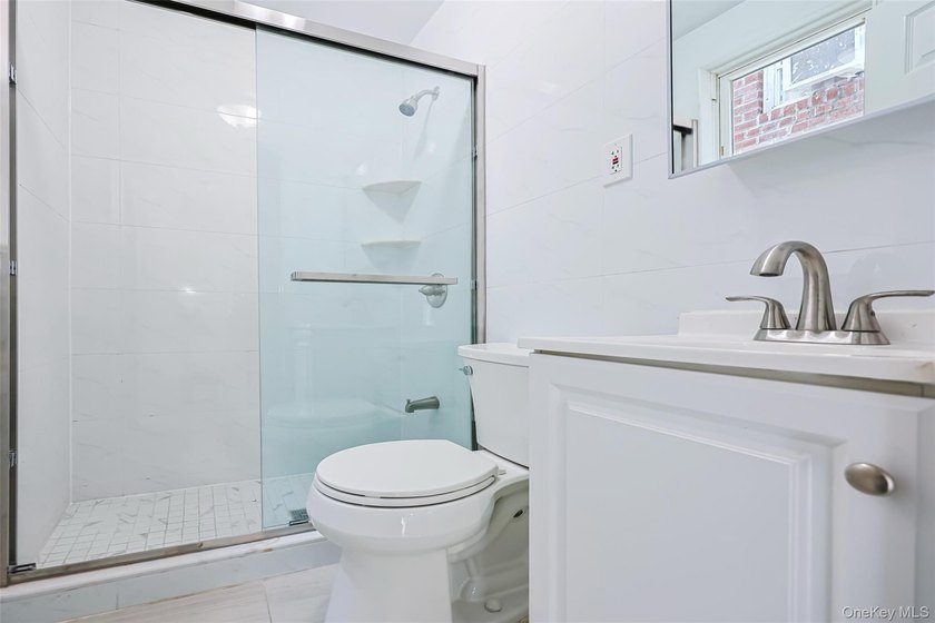 Welcome to this beautifully renovated detached 2-family home in - photo 17