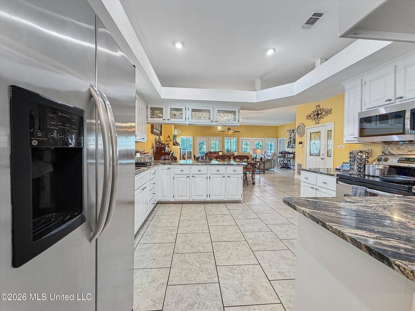 Welcome to this Riverfront gem on the Tchoutacabouffa! 3 Beds | - photo 17