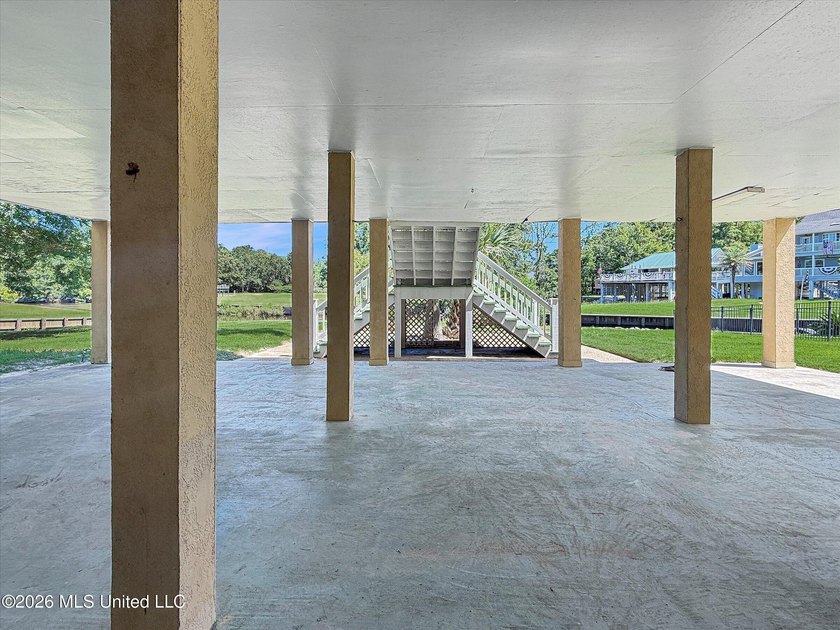Welcome to this Riverfront gem on the Tchoutacabouffa! 3 Beds | - photo 26