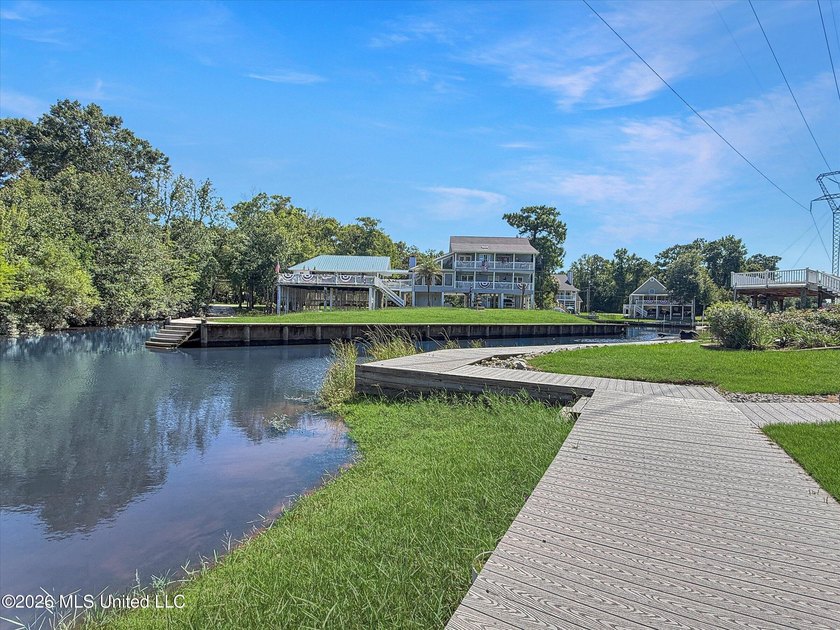 Welcome to this Riverfront gem on the Tchoutacabouffa! 3 Beds | - photo 27