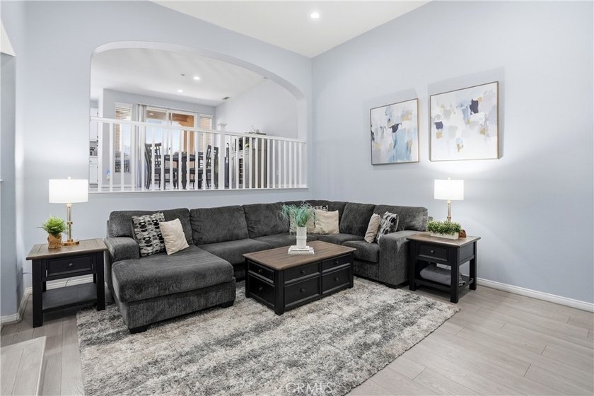 Welcome to this highly upgraded three-bedroom residence in the - photo 3