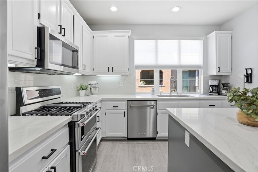 Welcome to this highly upgraded three-bedroom residence in the - photo 6