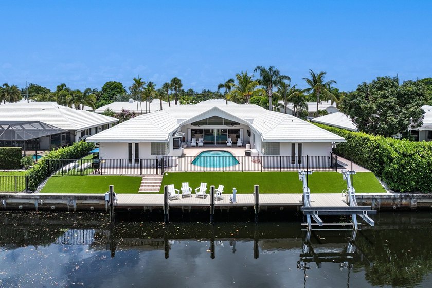 Welcome to this exceptional single-story waterfront residence in - photo 2