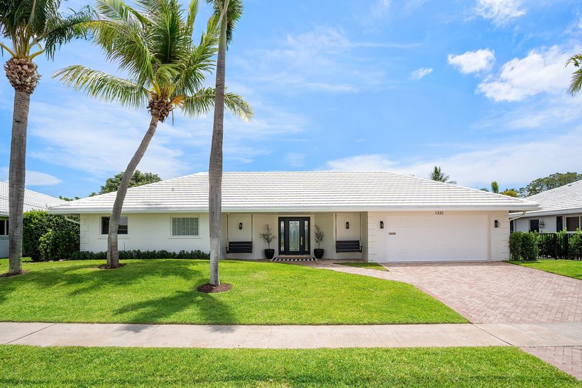 Welcome to this exceptional single-story waterfront residence in - photo 3